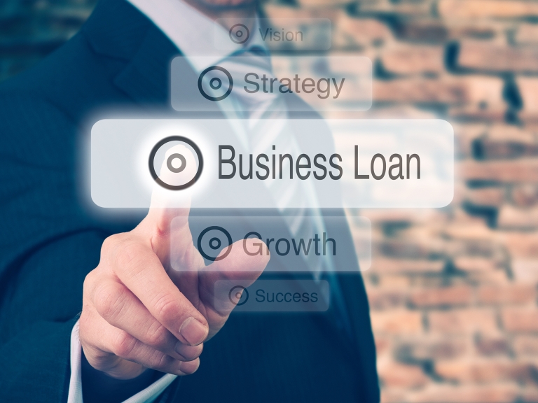 Businessman pressing a Business Loan concept button. Instagram styling applied. Businessman,Pressing,A,Business,Loan,Concept,Button.,Instagram,Styling,Applied.